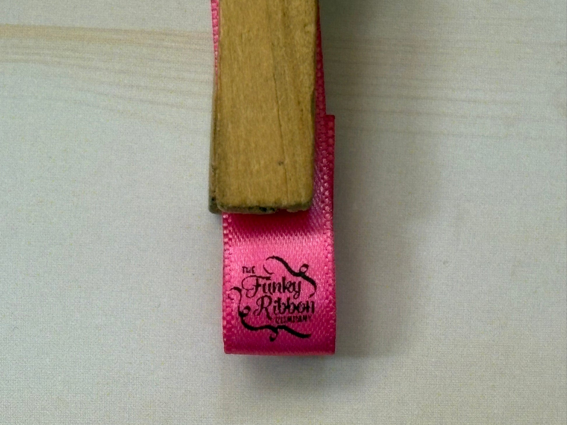 Pink ribbon with personalised logo