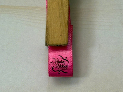 Pink ribbon with personalised logo