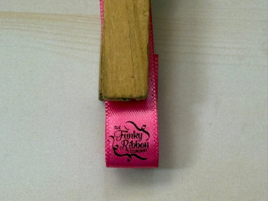 Pink ribbon with personalised logo
